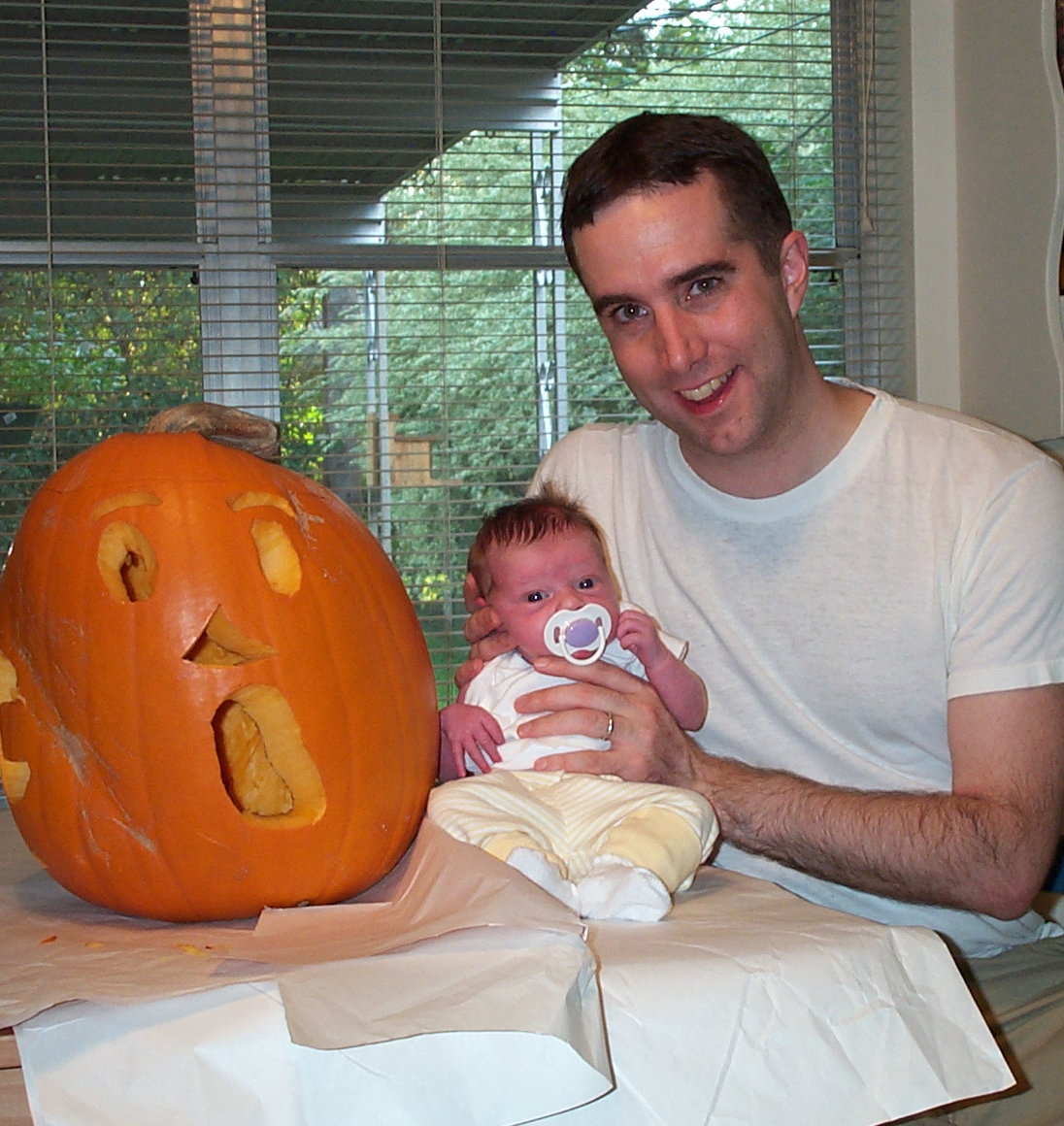 103104_Peter with Leah and her 1st Pumpkin_crop.jpg